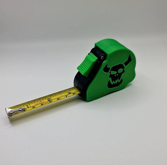 Ork greenskin tape measure extended showing dual scale - Warhammer 40K 10ft measuring tool with Waaagh emblem