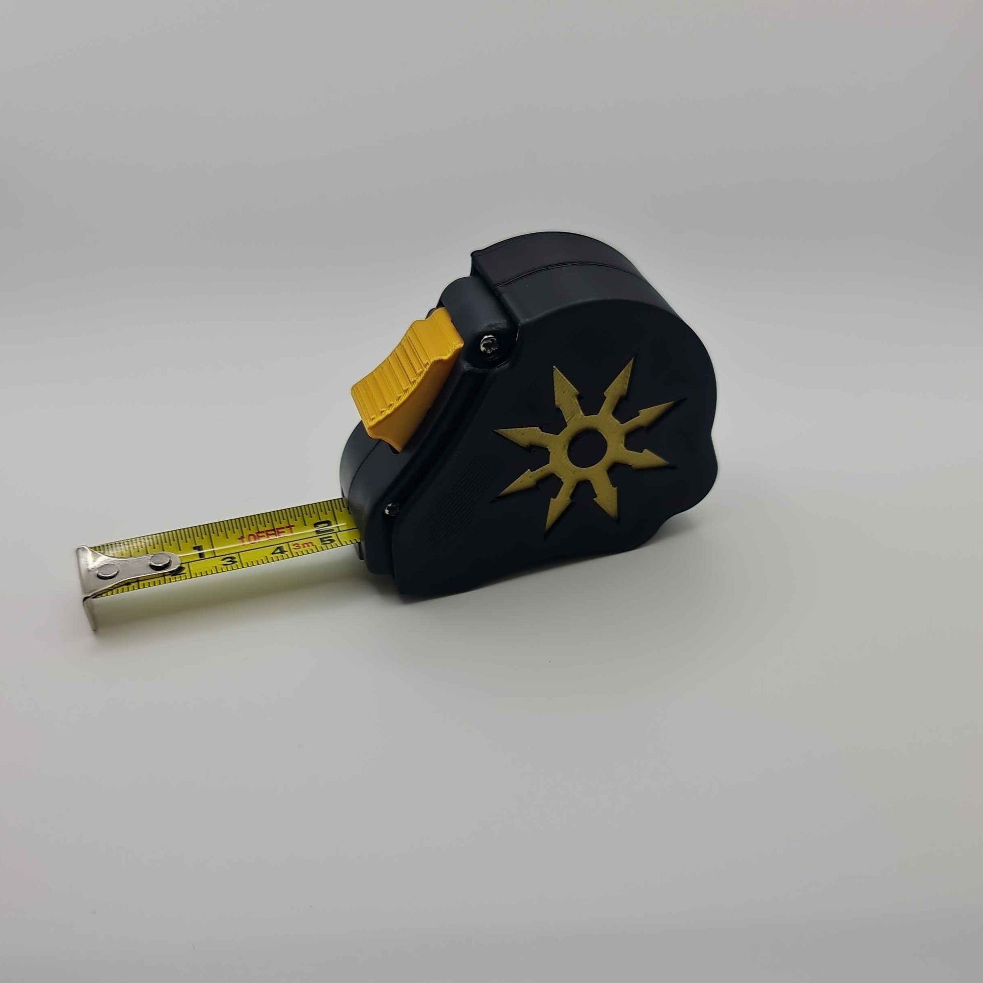 Chaos tape measure extended showing dual scale - Warhammer 40K 10ft measuring tool with chaos emblem