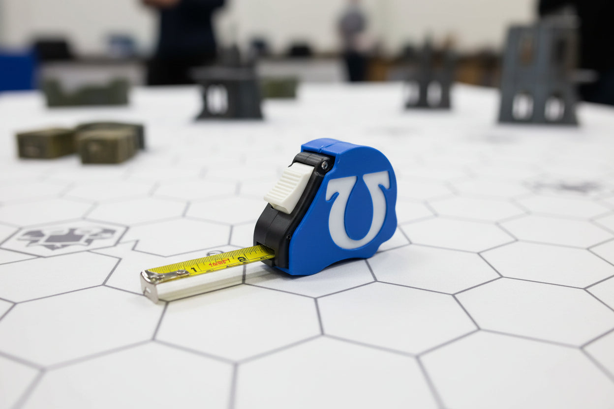 Ultramarines Space Marine tape measure extended showing dual scale - Warhammer 40K 10ft measuring tool with chapter emblem