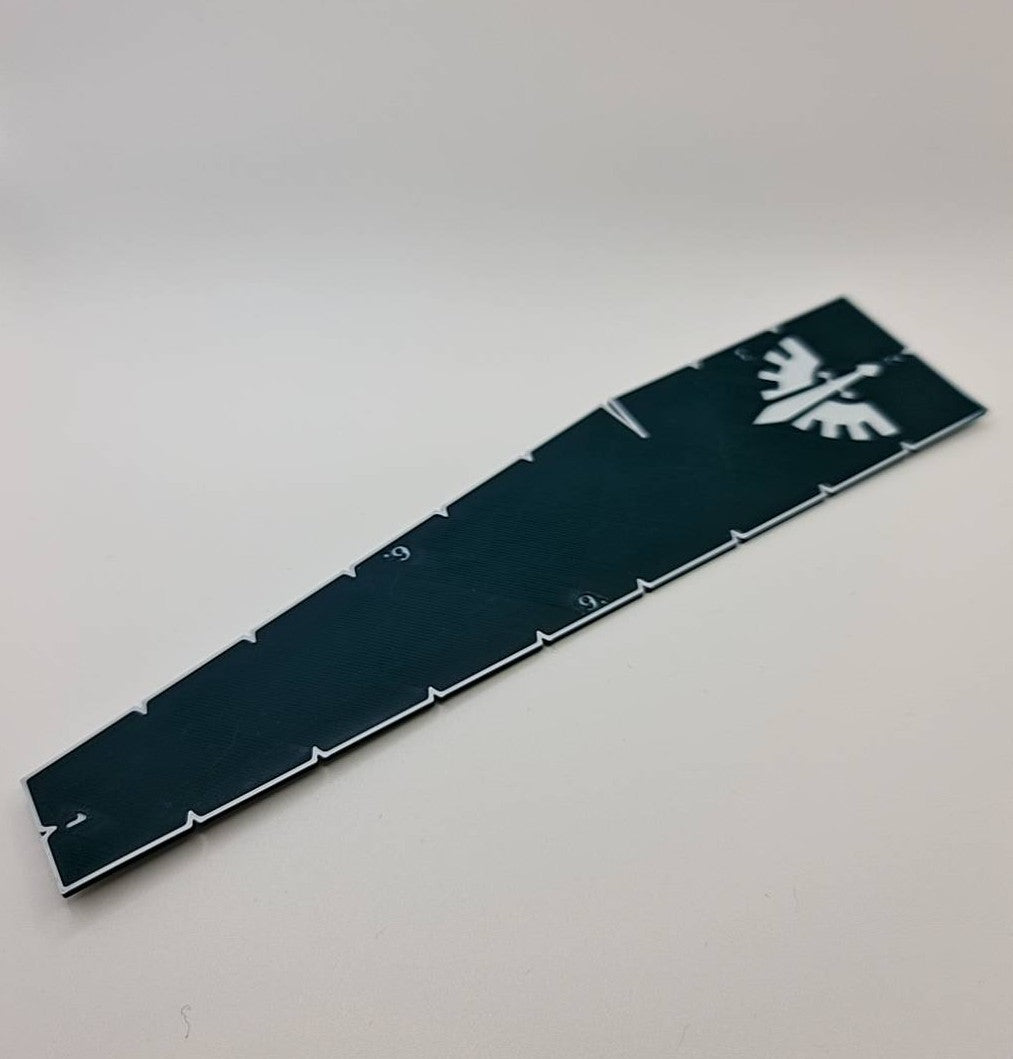 Dark Angels Space Marine measurement tool displaying game ranges - Warhammer 40K 9 6 3 2 1 inch ruler with first legion emblem dark green