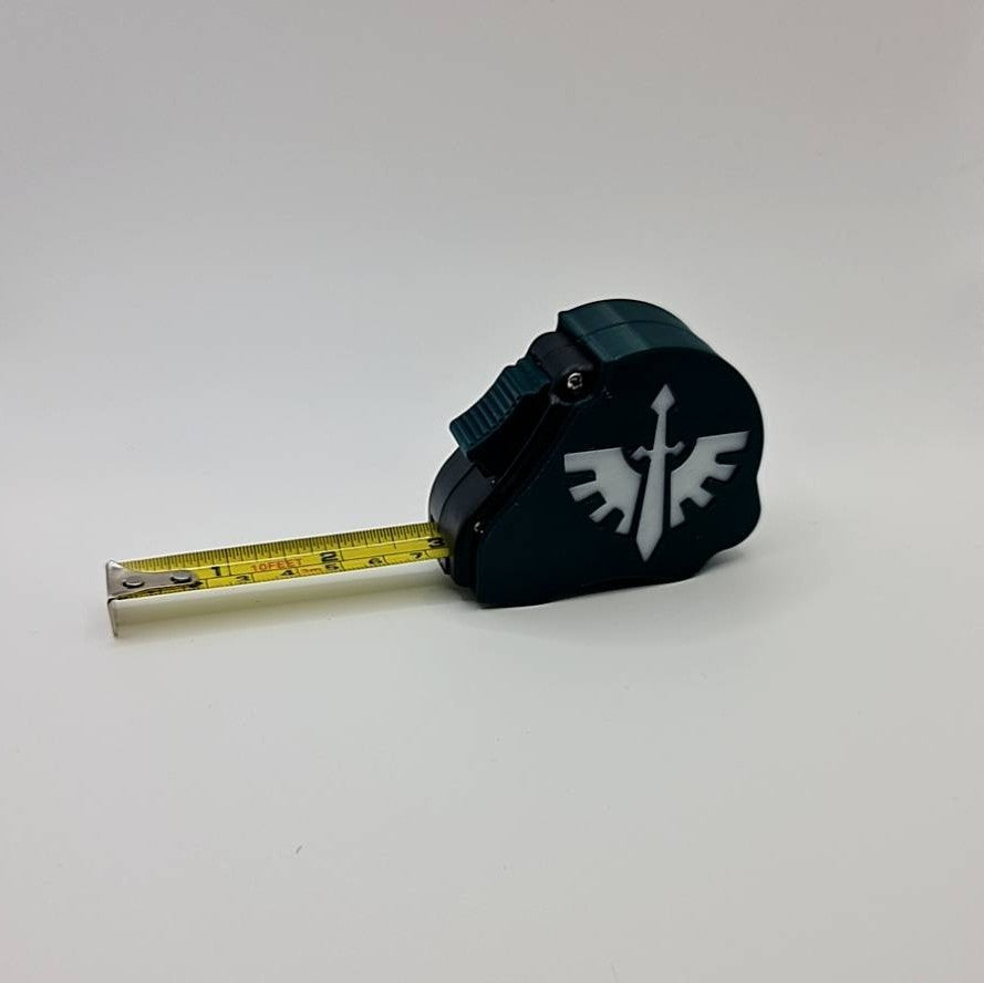 Dark Angels Space Marine tape measure extended showing dual scale - Warhammer 40K 10ft measuring tool with first legion emblem
