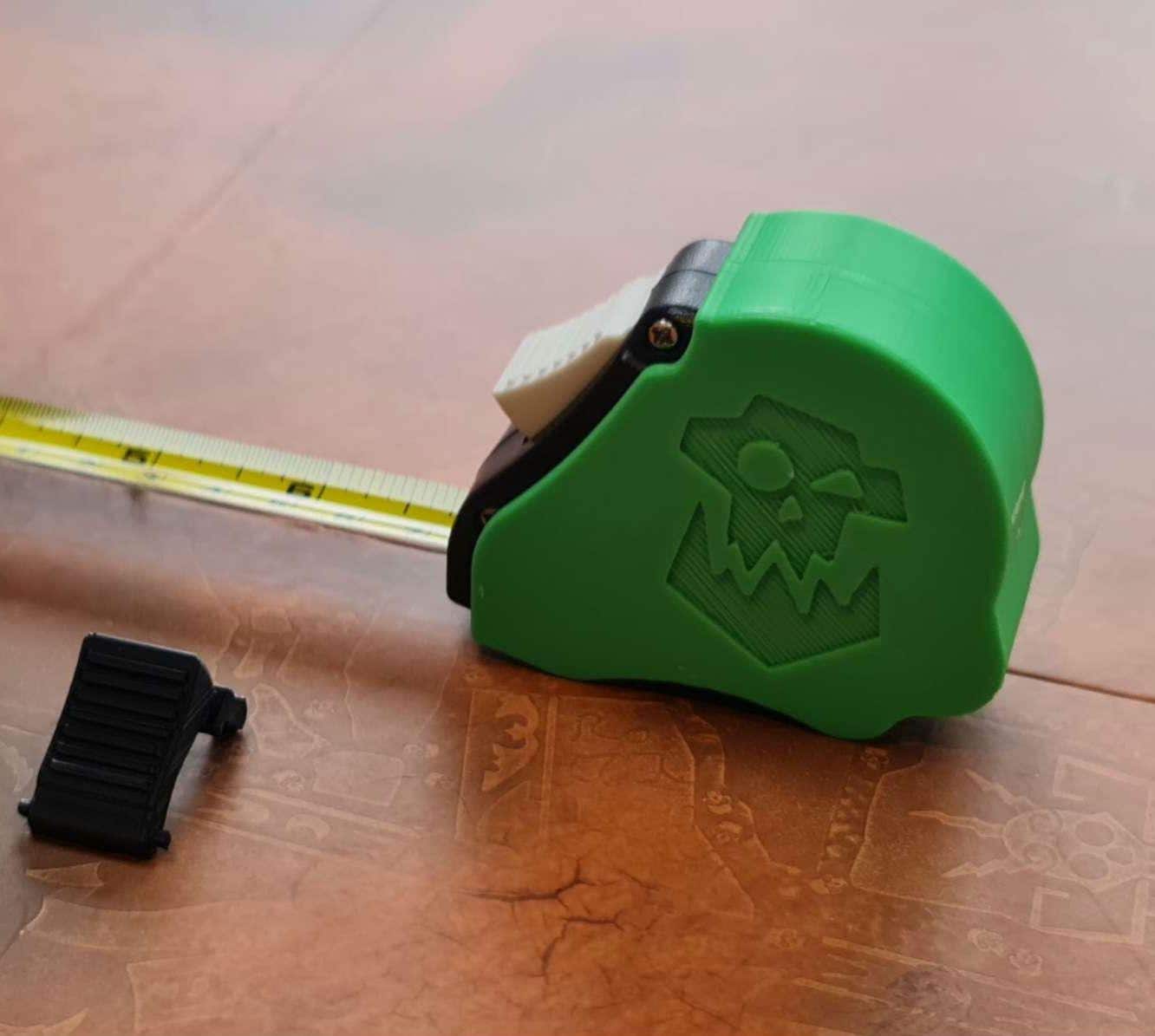 Ork tape measure extended showing dual scale - Warhammer 40K 10ft measuring tool