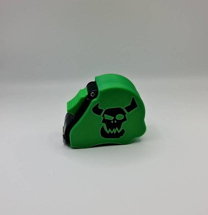 Ork greenskin tape measure - Warhammer 40K 10ft measuring tool with Waaagh emblem angled