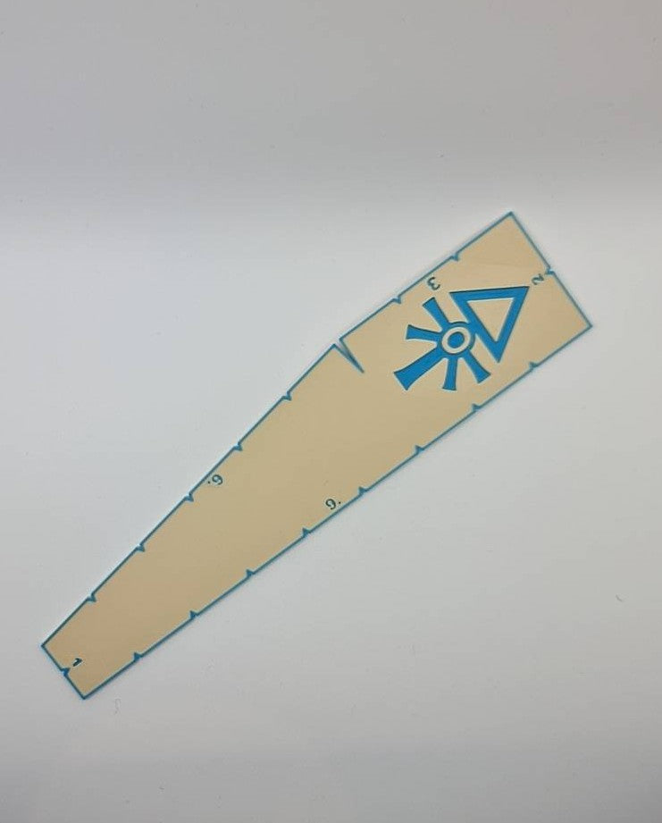 Space Elves Aeldari measurement tool displaying game ranges - Warhammer 40K 9 6 3 2 1 inch ruler with craftworld emblem
