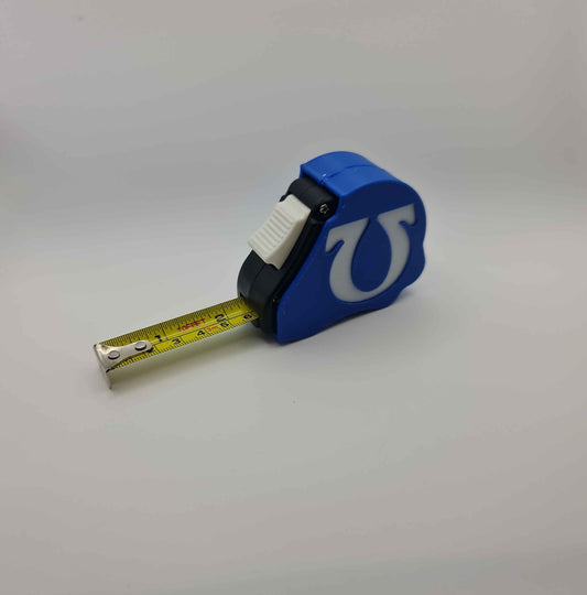 Ultramarines Space Marine tape measure extended showing dual scale - Warhammer 40K 10ft measuring tool with chapter emblem